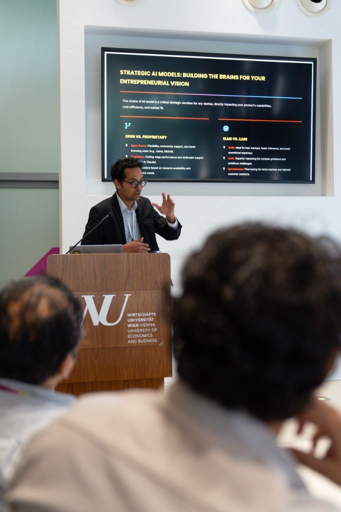 Presenting at the WU Wien podium during the AI agents workshop